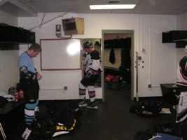 Petey voguing in front of the mirror in the locker room.